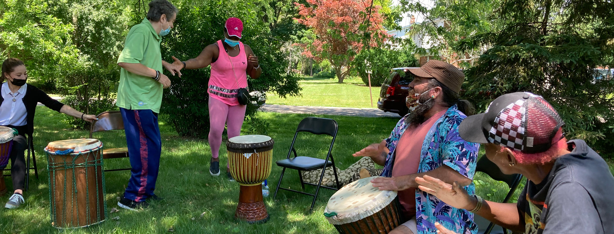 Sundance DiDomenico and Gesher Human Services' Musicians During a 2021 Drum Circle